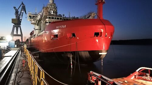 Icebreaker at dock in dawn light
