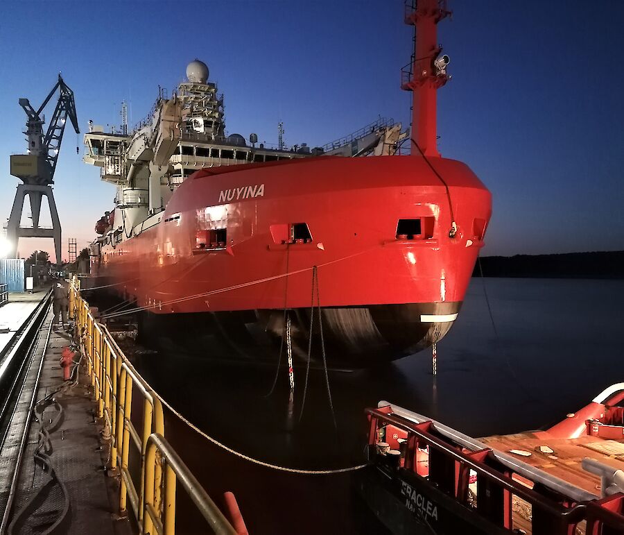 Icebreaker at dock in dawn light