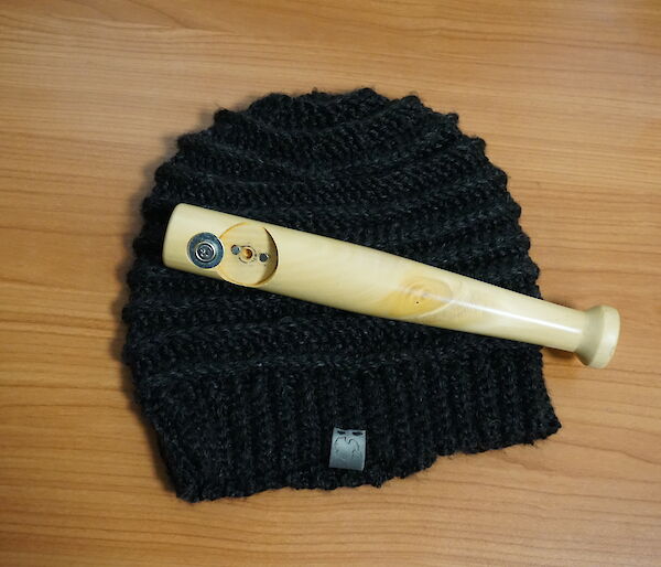 A locally knitted beanie and bottle opener made for an expeditioners birthday at Casey