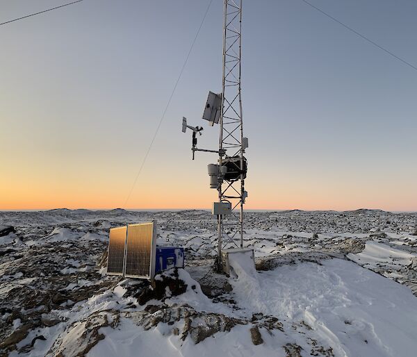 A piece of technical equipment with a orange sky in the background
