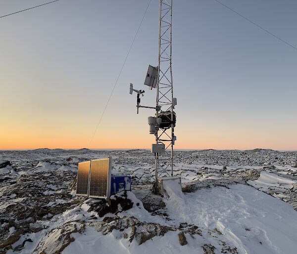 A piece of technical equipment with a orange sky in the background