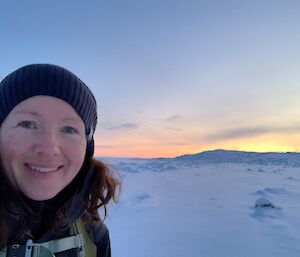 A women taking a selfie with a snow background