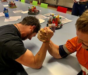 Two expeditioners having an arm wrestle
