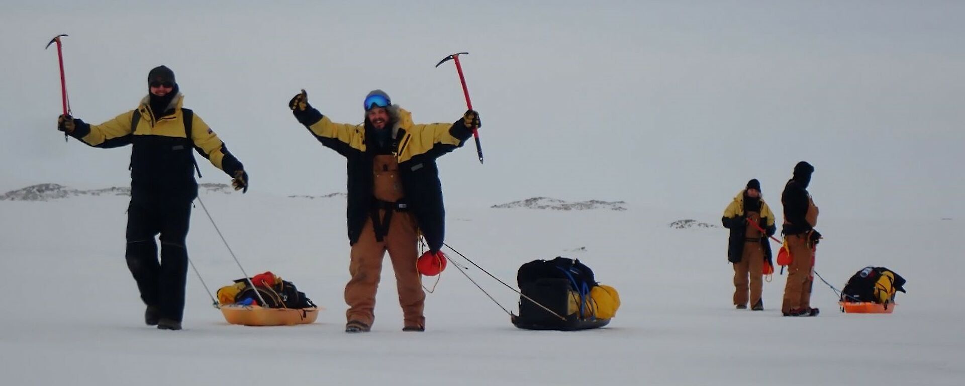 Expeditioners hauling sleds across the sea ice at Casey recently