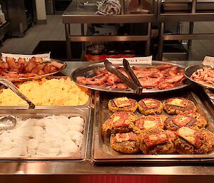 A selection of typical brunch menu items ready for serving in the bain marie