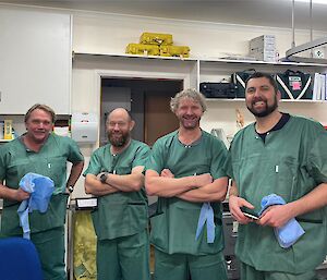 Four lay surgical assistants in training in theatre