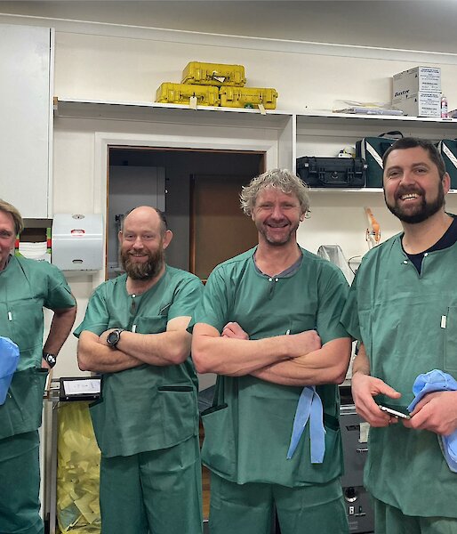 Four lay surgical assistants in training in theatre