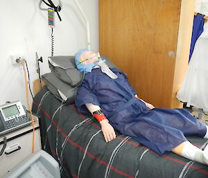 A training dummy lying on a bed