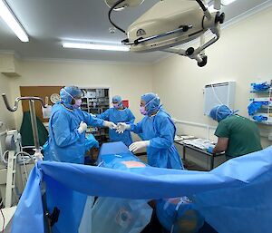 Doctor and assistants practicing in the operating theatre