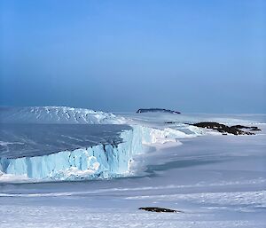 Landscape of ice cliffs and sea ice along the coast