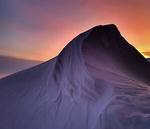 Neon Sky and snow drift on a snowy mountain