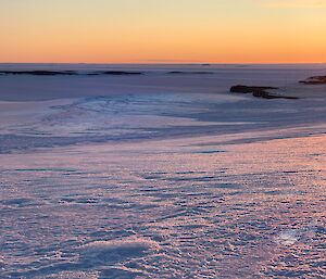 Neon Sky, mauve ice, luminescent blue patches on the ice