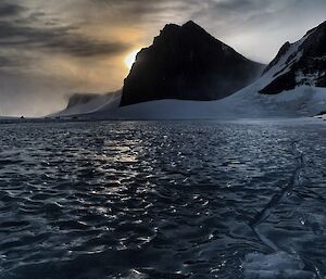 Dark mountain and sea ice