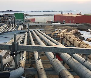 An array of site services pipes outside around station