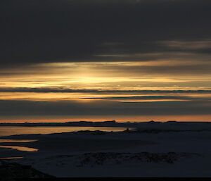 An early afternoon reflective moment in winter at Casey station