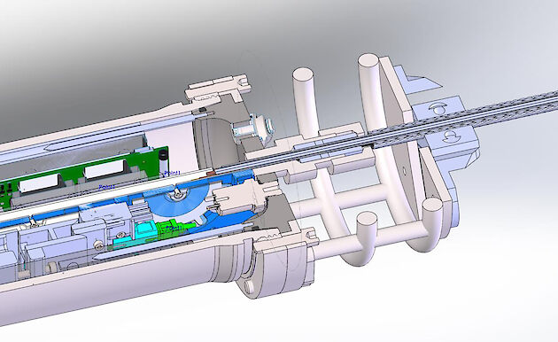 A model graphic showing the electrical-optical-mechanical cable running through a penetrator into the end cap and terminating in a titanium pressure housing.