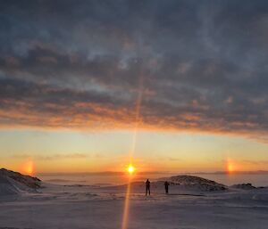 Sun dogs over the sea ice at sunset near Casey