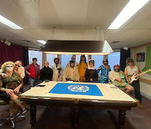 Mawson station's movie set with actors in costume assembled around a table