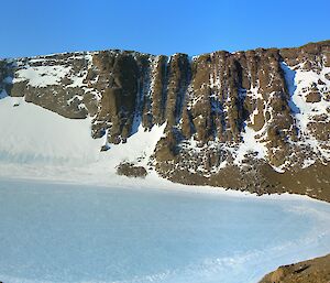 An shot taken from the top of the mountain looking down in to the valley which contains the frozen lake