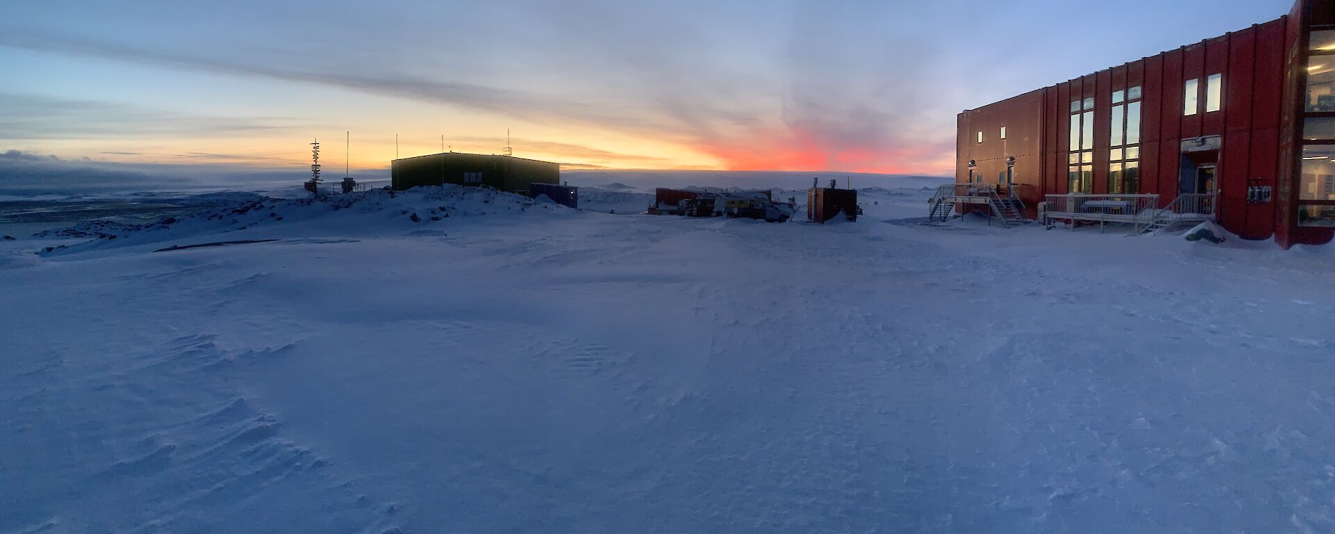 The sun rising above the plateau on a crisp winters morning at Casey