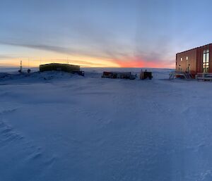 The sun rising above the plateau on a crisp winters morning at Casey