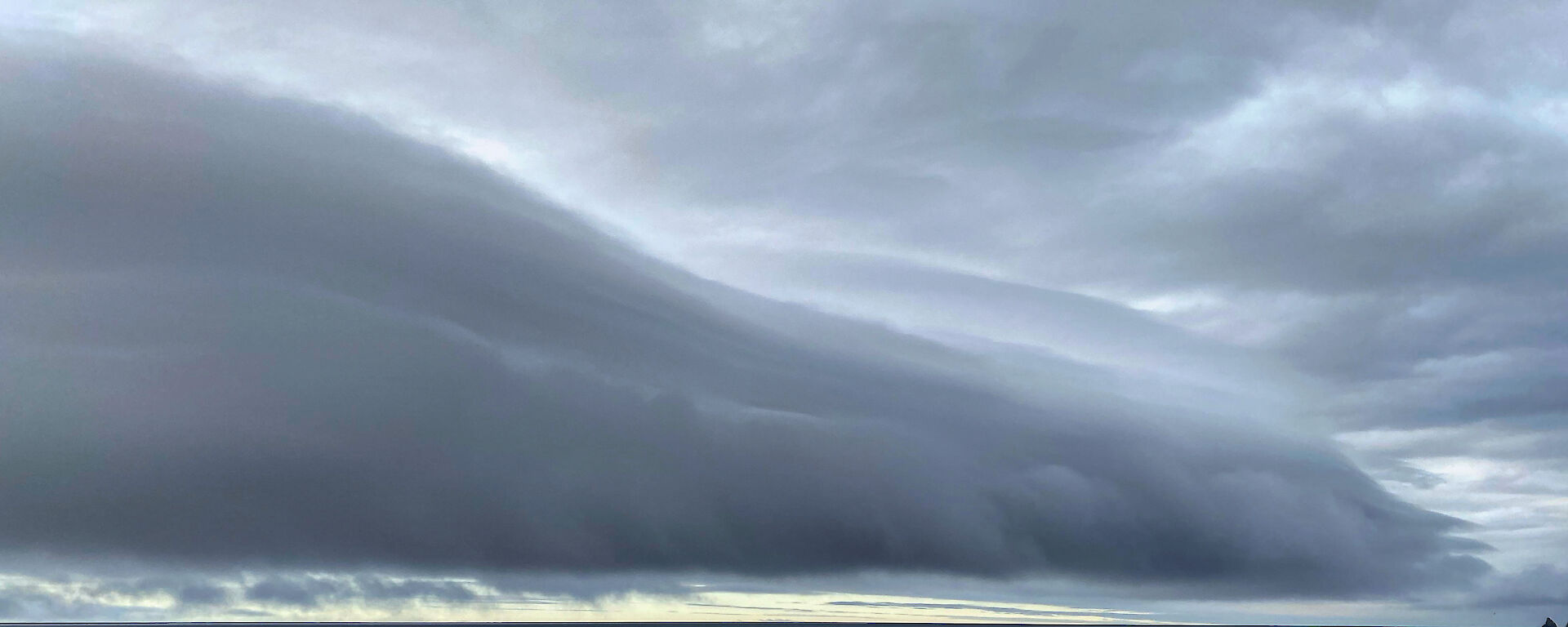 Roll of dark moody cloud over the ocean