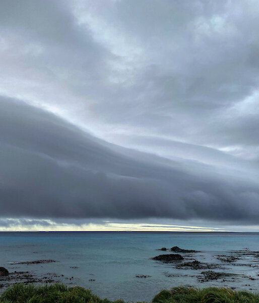 Roll of dark moody cloud over the ocean