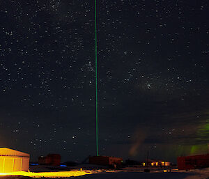 A laser beam from the station shooting up into the sky