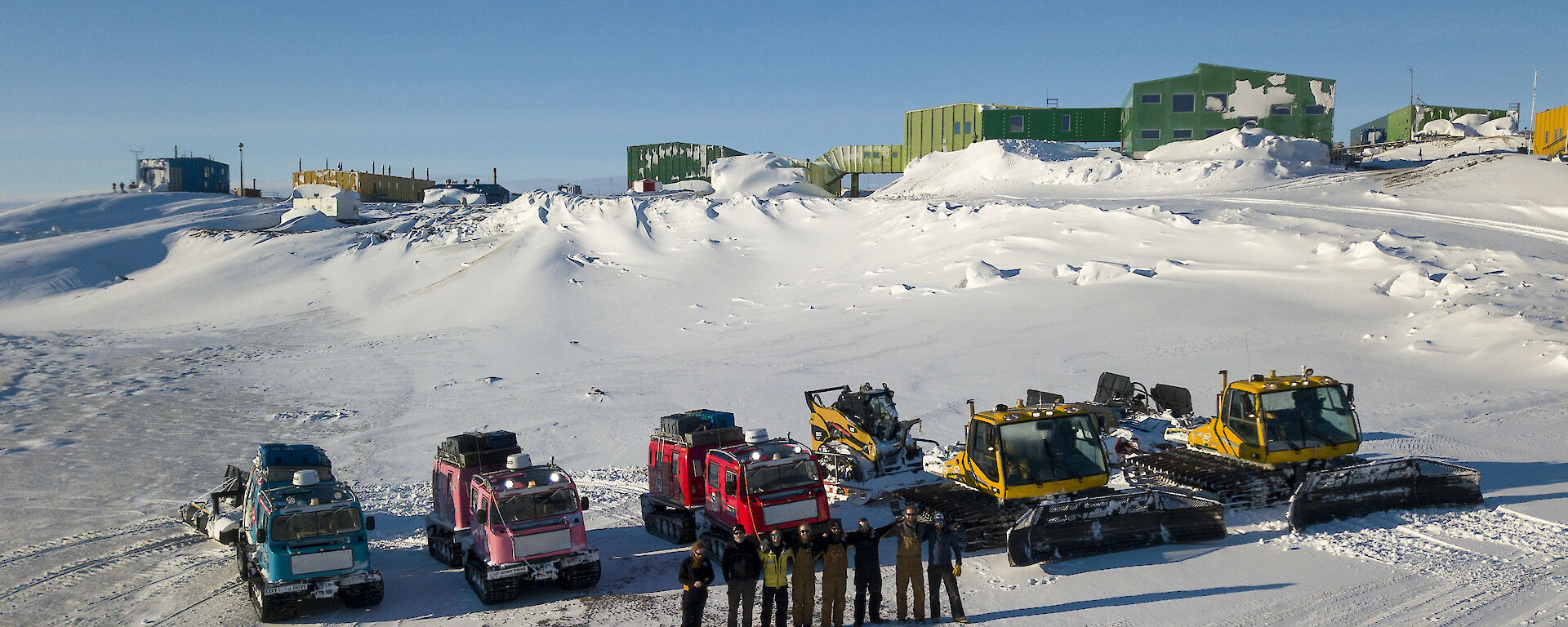 A convoy of vehicles parked on the beach