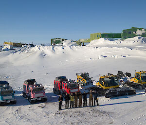 A convoy of vehicles parked on the beach