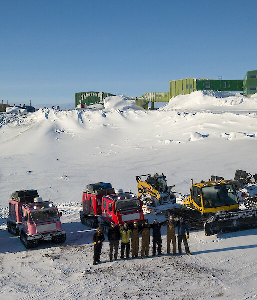 A convoy of vehicles parked on the beach