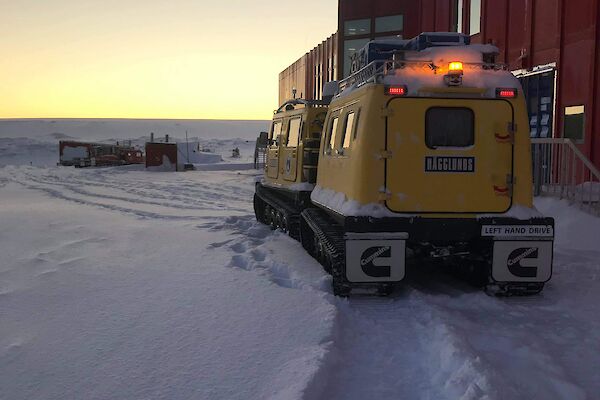 The yellow Hagg outside the Red shed at Casey station waiting to leave for Browning