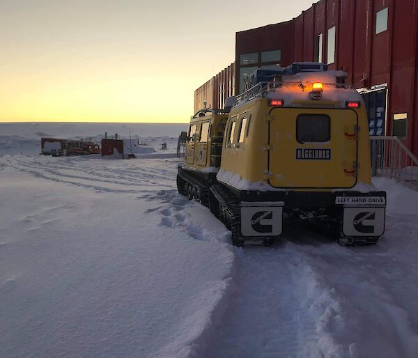 The yellow Hagg outside the Red shed at Casey station waiting to leave for Browning