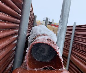 Looking in to the end of a broken hose which contains frozen water