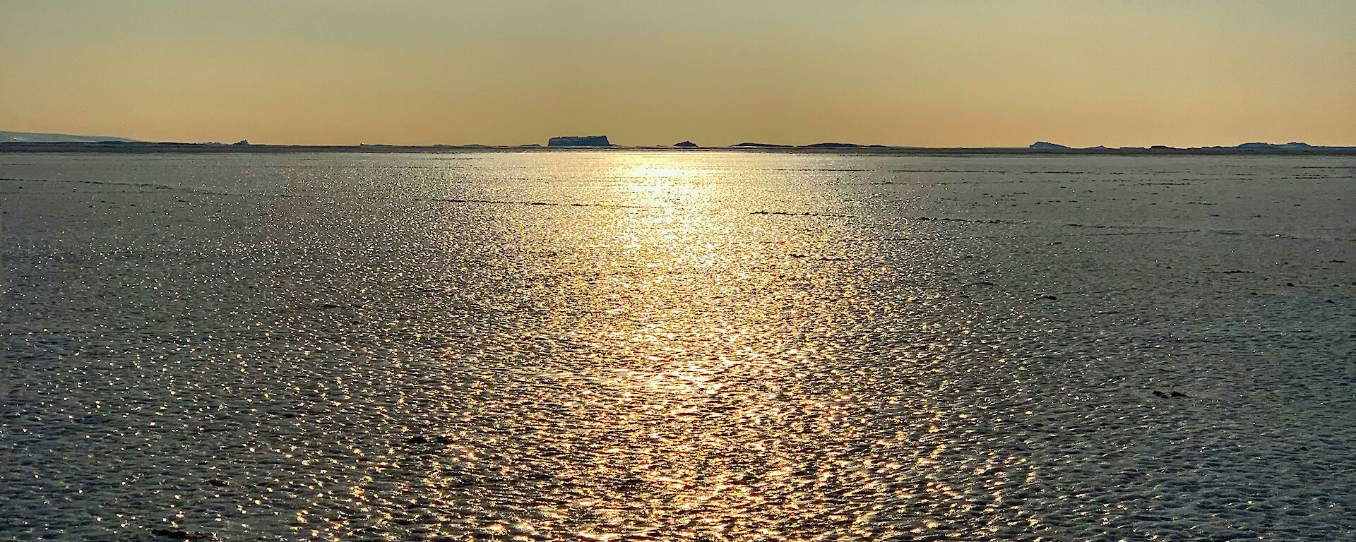 Frozen ice to the horizon, lit by the sun