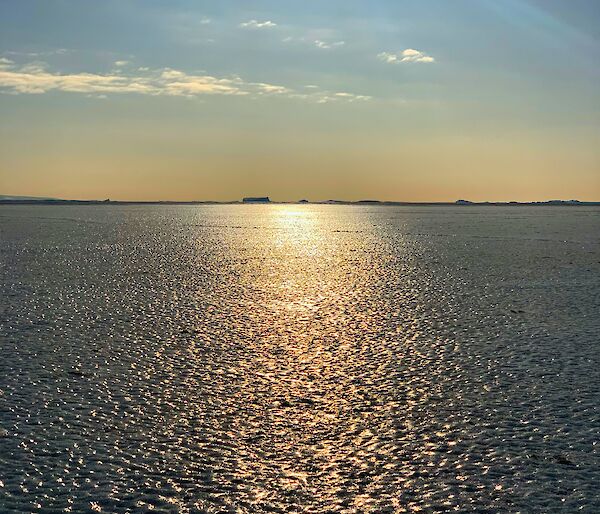 Frozen ice to the horizon, lit by the sun