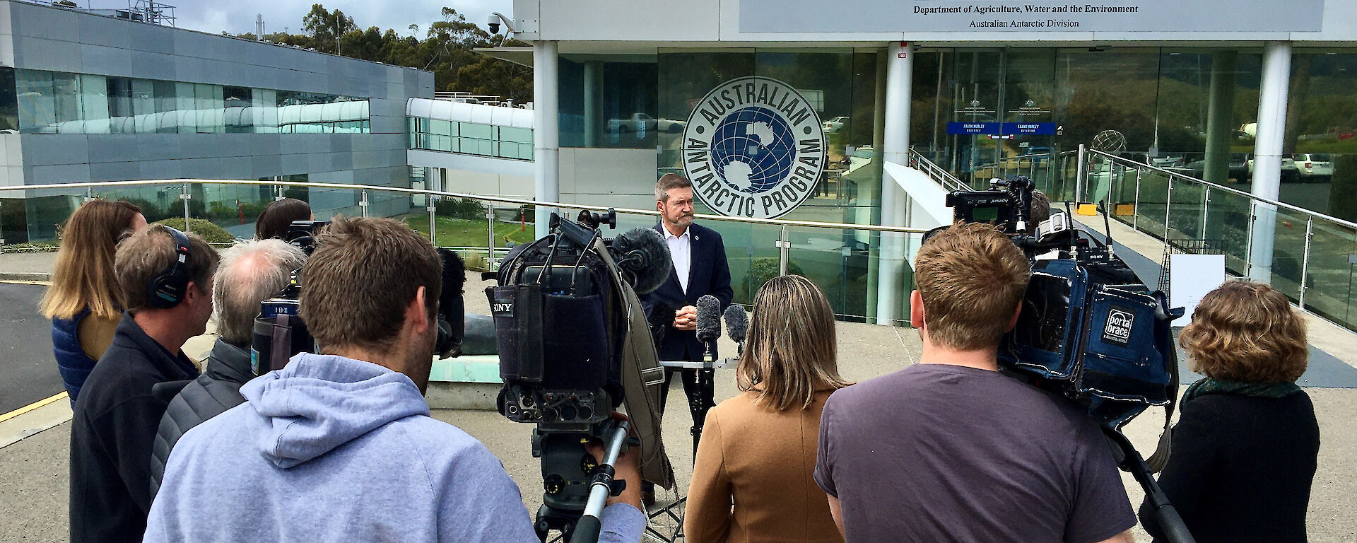 press conference in front of AAD headquarters