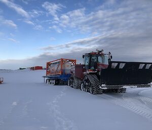 A tractor with fuel tank and sled heading up to Wilkins