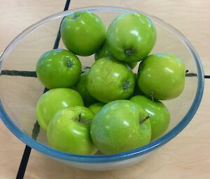 Granny Smith apples in a bowl.