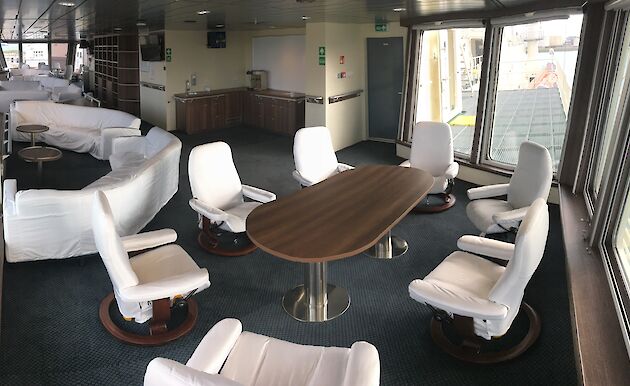 Tables and chairs in the science observation area of the Nuyina.