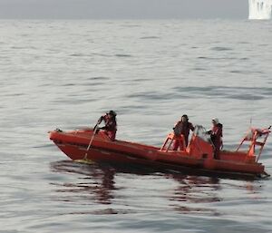 Inflatable rubber boat brings in a mooring