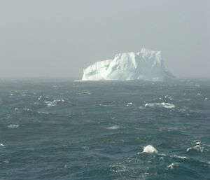 Iceberg and approaching storm in the Southern ocean