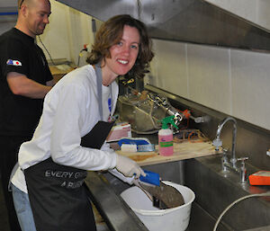 Wendy scrubbing shoes prior to arriving in Antarctica