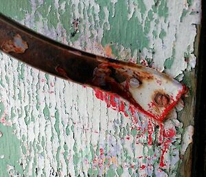 Peeling paint on the door of Rawin hut