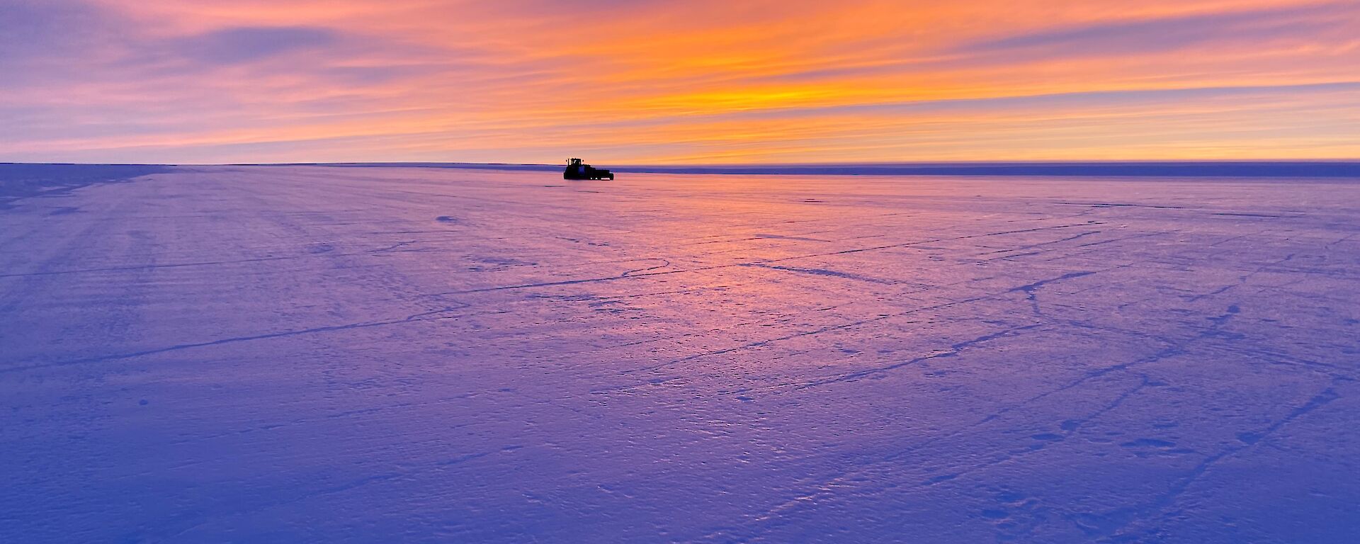 Proof-rolling machinery sits on the Wilkins runway at dawn