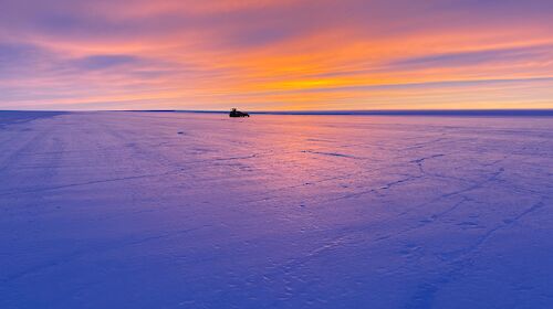 Proof-rolling machinery sits on the Wilkins runway at dawn