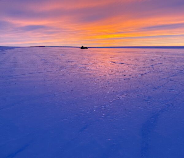 Proof-rolling machinery sits on the Wilkins runway at dawn