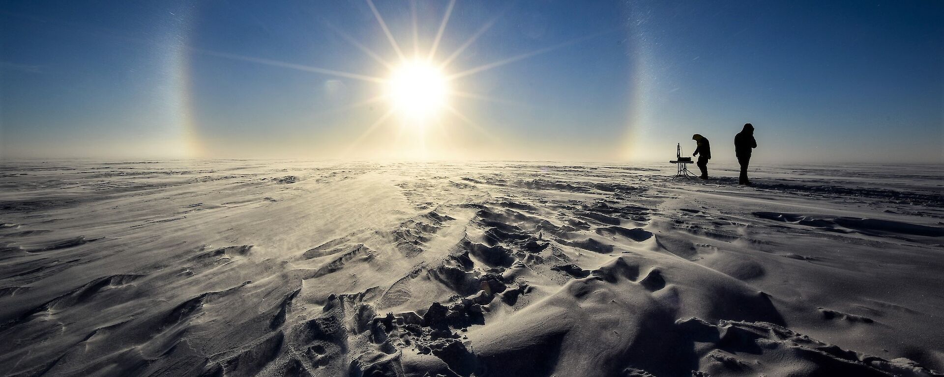Two scientists working in the field in Antarctica