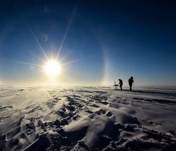 Two scientists working in the field in Antarctica