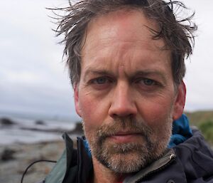 close-up of windswept man's face